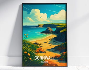 May include: A framed art print featuring a vibrant coastal landscape of Cornwall, England. The artwork depicts a turquoise sea, sandy beach, and green cliffs under a bright blue sky with fluffy white clouds. The word "CORNWALL" is displayed in white text.