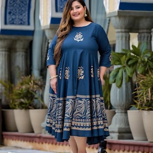 May include: A blue and gold printed maxi dress with a round neckline and three-quarter sleeves. The dress has a flowing skirt and a floral pattern.
