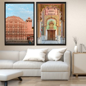 May include: Two framed photographs of a pink palace in India. The first photo shows the exterior of the palace, while the second photo shows a colorful archway leading to a doorway.