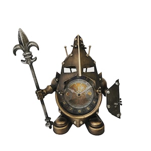 May include: A clock shaped like a knight in armour, with a spear and shield. The clock face is round and has Roman numerals. The knight is made of metal and has a bronze finish.