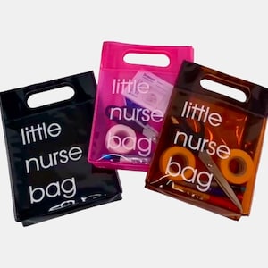 May include: Three transparent tote bags with a handle cut-out. Each bag has the words "little nurse bag" printed in white. The bags are black, pink, and brown, and contain medical supplies like tape and scissors.