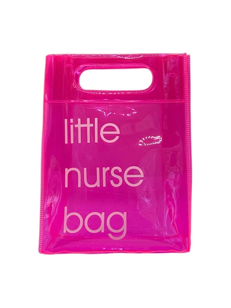 May include: A bright pink, transparent tote bag with a rectangular handle opening at the top. The words "little nurse bag" are printed in white, centered on the front of the bag. The bag is made of a shiny, clear material.