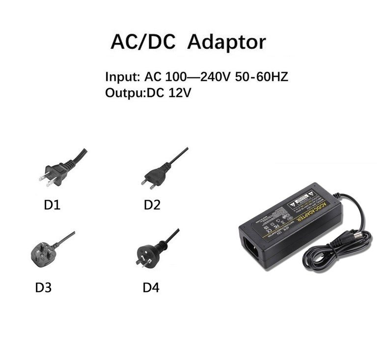 May include: A black AC/DC adapter with a power cord and four different plug types. The adapter has the text "AC/DC ADAPTER" printed on it. The text "Input: AC 100-240V 50-60HZ Outpu:DC 12V" is printed above the adapter.