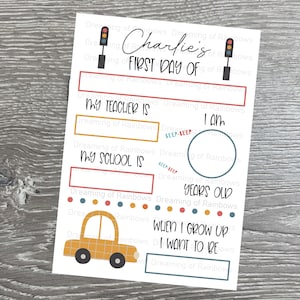 May include: A printable first day of school sign with a yellow school bus, traffic lights, and spaces to fill in the child's teacher, school, age, and future career aspirations. The sign says "Charlie's First Day Of".