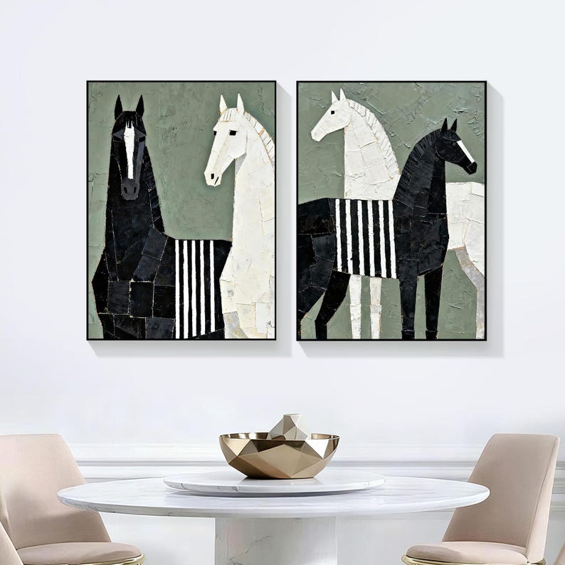 May include: Two framed abstract art pieces featuring horses. One painting shows a black horse and a white horse, both with striped details. The other painting shows a white horse and a black horse, also with striped details. The background is a muted green.
