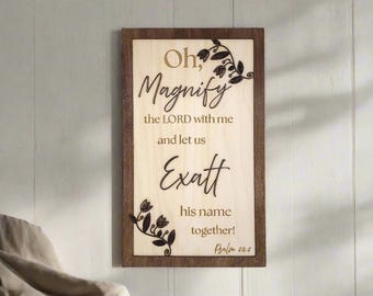 May include: Wooden sign with a brown frame and a light wood background. The sign has a floral design and the text "Oh, Magnify the LORD with me and let us exalt his name together! Psalm 24:3"
