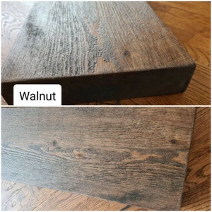 K&ouml;nnte beinhalten: Nahaufnahme einer dunkelbraunen Holzplanke mit nat&uuml;rlicher Holzmaserung. Das Holz hat eine glatte, polierte Oberfl&auml;che. Der Text "Walnut" ist im Bild sichtbar.