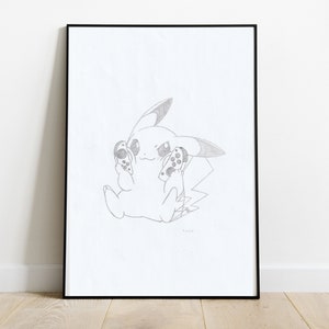 May include: Pencil sketch of Pikachu holding two game controllers, framed in a black border. The artwork is on white paper and features the iconic character with a determined expression. The image is displayed against a white wall.