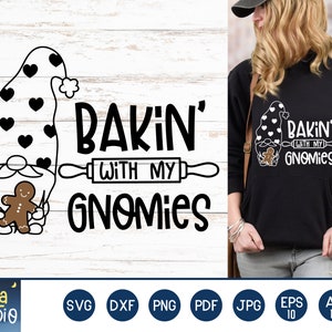 May include: A black and white design featuring a gnome holding a gingerbread man with the text "Bakin' with my Gnomes" and a rolling pin.