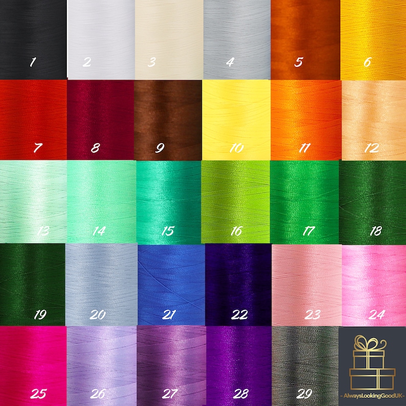 Puede incluir: Una tabla de 29 carretes de hilo de bordar de diferentes colores. Los carretes est&aacute;n dispuestos en una cuadr&iacute;cula de seis columnas y cinco filas. Los colores incluyen negro, blanco, rojo, marr&oacute;n, amarillo, naranja, verde, azul, morado, rosa y gris.