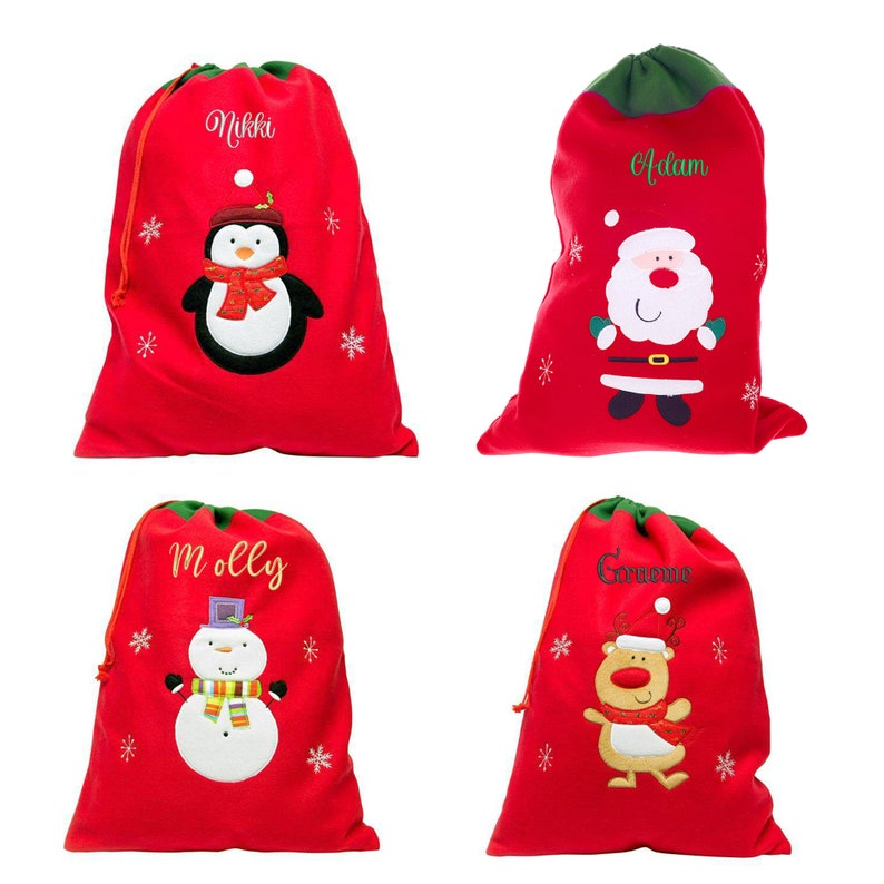 May include: Four red Christmas gift bags with green drawstrings. Each bag features a different embroidered design: a penguin, Santa Claus, a snowman, and a reindeer. The bags are personalized with the names Nikki, Adam, Molly, and Corinne.