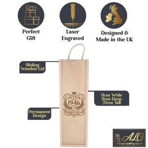 May include: A light-colored wooden wine box with a sliding lid and a rope handle. The front features a laser-engraved design with the text 'Vintage 1946 Limited Edition Aged to Perfection'. The box measures 11cm wide, 11cm deep, and 35cm tall.