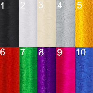 May include: Ten spools of thread in various colors, including black, white, cream, gray, yellow, red, green, purple, pink, and blue. The spools are numbered 1 through 10.