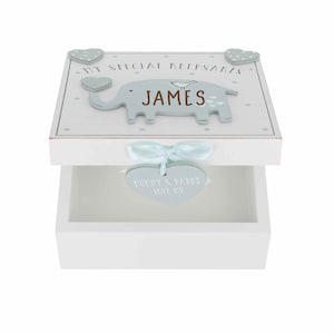 May include: White wooden keepsake box with a blue elephant and bird design. The box has a heart-shaped tag that says "Mommy & Daddy Love You". The box is personalised with the name "JAMES".