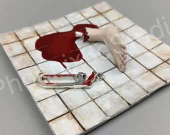 Handmade Horror Tile Magnet: Severed Leg & Saw - Unique Horror Fan Gift