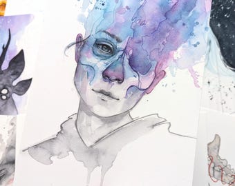 May include: Watercolour painting of a person's face with blue and purple watercolour splatters. The person's face is partially obscured by the splatters, and their eyes are visible. The painting is signed "Tih." in the bottom right corner.