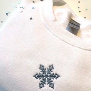 Sudadera con bordado de copos de nieve