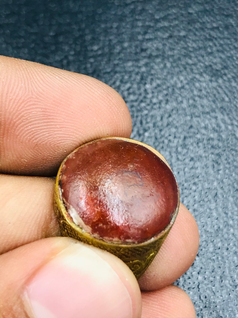 Handmade brass ring from Afghani with orange glass