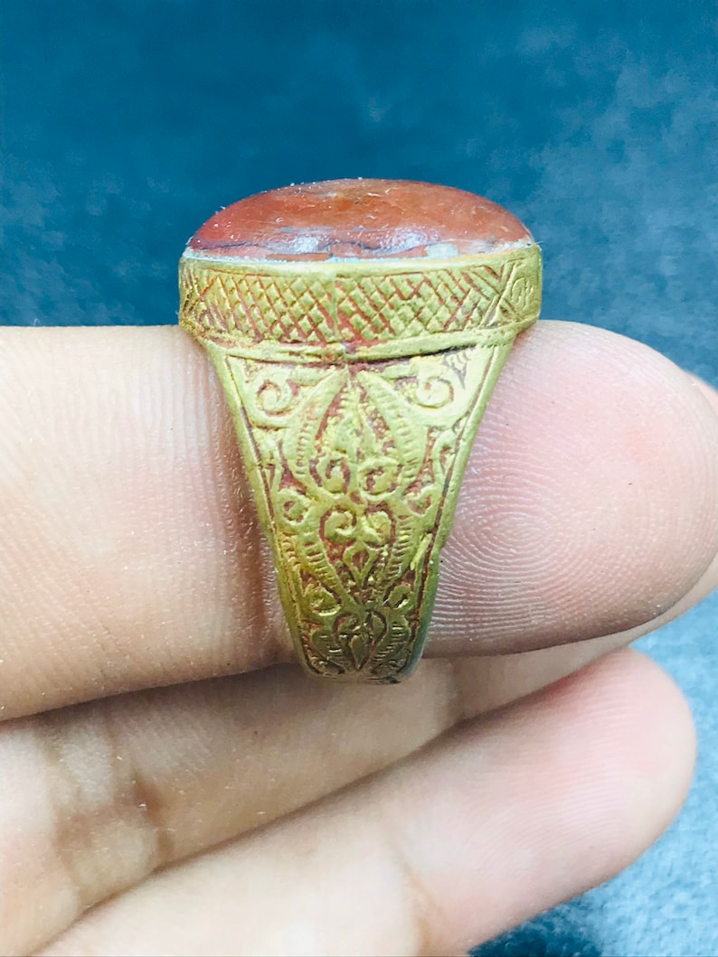 Handmade brass ring from Afghani with orange glass
