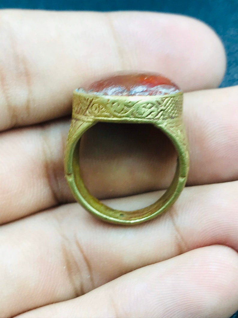 Handmade brass ring from Afghani with orange glass