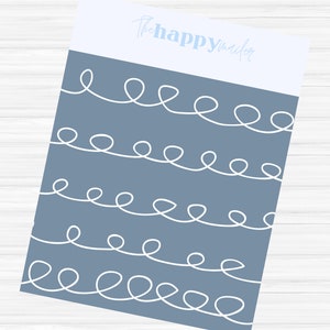 May include: A stationery sheet with a blue-gray background and white looping lines. The top section is white with the light blue text "thehappymailer". The design is simple and modern.