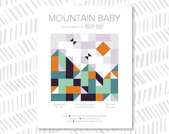 May include: A quilt pattern called "Mountain Baby" by Moody Baby. The pattern is for a quilt that is 91.44 cm by 91.44 cm. The pattern features a geometric design with mountains, a sun, and a sky. The pattern is beginner level.