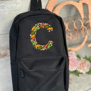 Mochila con diseño inicial de Dino personalizada bordada, mochila, bolsa de dinosaurio para niños, letra