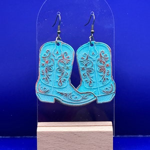 Laser geschnittene baumelnde Cowboystiefel können ein großes Geschenk sein.