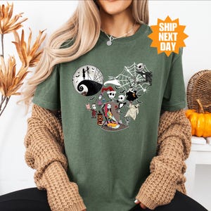 a woman wearing a green halloween t - shirt