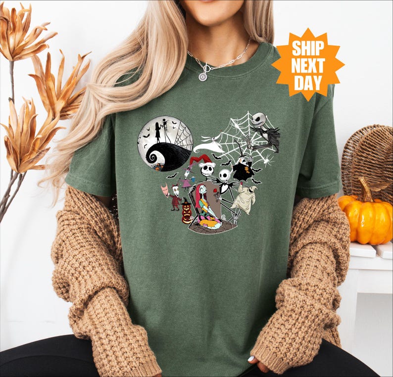 a woman wearing a green halloween t - shirt