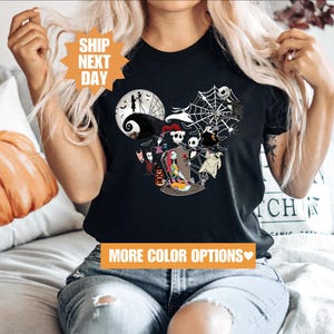 a woman sitting on a couch wearing a mickey mouse shirt