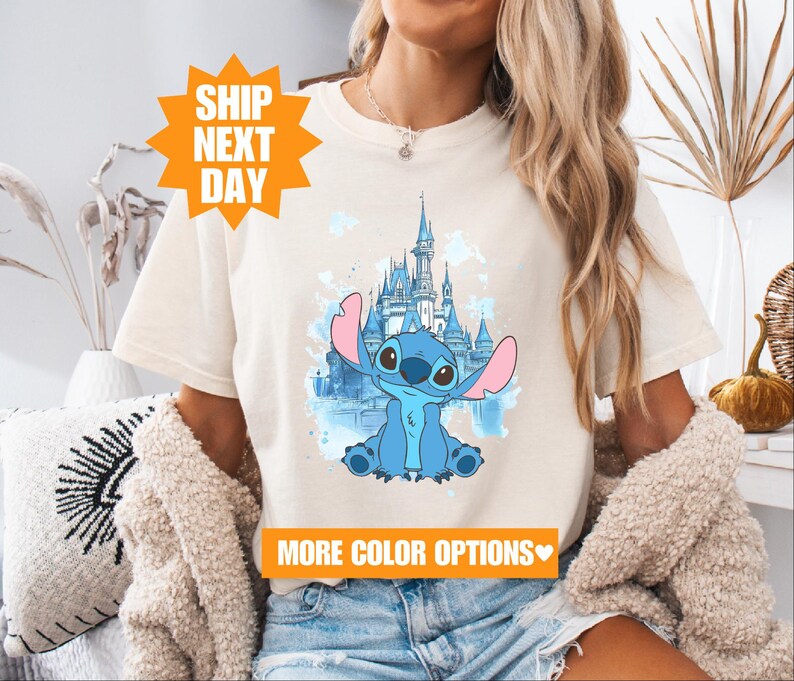 a woman wearing a t - shirt with a picture of a cartoon character on it