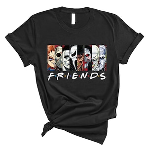 May include: Black t-shirt featuring a graphic of horror movie characters and the text "FRIENDS" in a stylised font.