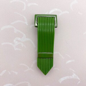 Art Deco metal green dress clip