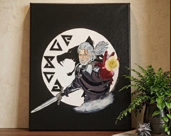 May include: A canvas art print featuring a character with white hair, a sword, and a glowing orb. The artwork is set against a black background with a white circle and a wolf silhouette. The character is wearing dark armor and a red glove.