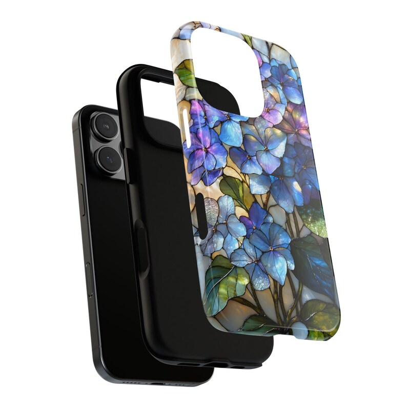 May include: A black smartphone with a protective case featuring a floral design. The case has a stained-glass style with blue and purple hydrangea flowers and green leaves. The case is detached from the phone.
