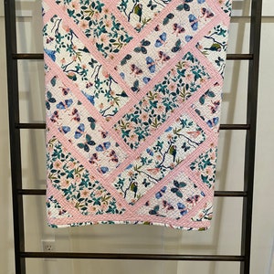 Pretty in pink baby girl quilt