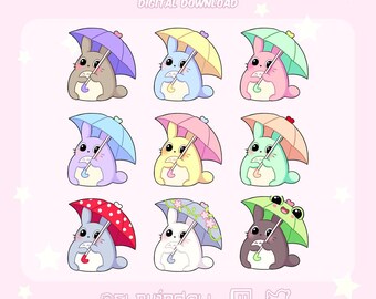 May include: Nine premade Twitch badges featuring cartoon bunny characters holding umbrellas. The bunnies are in various colors, including brown, blue, pink, and green. The umbrellas have different designs. Text at the top reads "PREMADE TWITCH BADGES DIGITAL DOWNLOAD".