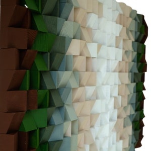 May include: A wall art piece made of wooden blocks in various shades of brown, green, blue, beige, and white. The blocks are arranged in a geometric pattern, creating a visually interesting and textured surface.