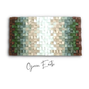 May include: A wall art piece made of squares of wood in shades of brown, green, blue, and white. The squares are arranged in a gradient pattern, with the darkest brown squares on the left and the lightest white squares in the center. The piece is titled "Green Earth".