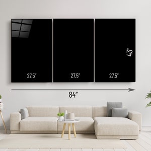 May include: A three-panel black and white canvas wall art set measuring 84 inches wide and 43 inches high. The set is displayed on a white wall above a beige sofa.