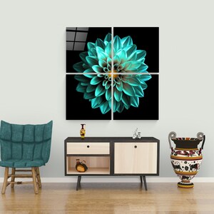 May include: A four-panel artwork showing a teal dahlia flower against a black backdrop. The flower's petals are detailed, with a yellow centre. The artwork is displayed above a wooden cabinet, with a chair and vase nearby.