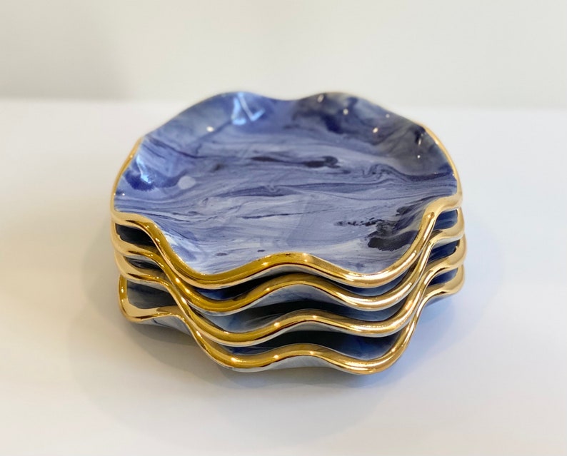 Ceramic coasters hand marbled with 22kt gold luster blue and whi Ceramic coasters hand marbled with 22kt gold luster blue and whi
