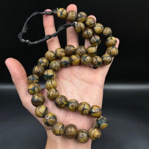 Old Venetian trade beads with faces late 1800’s old African trade beads skunk beads African glass beads glass trade beads Venetian