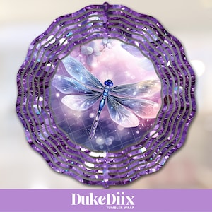 May include: Purple and blue dragonfly wind spinner with a sparkly background. The wind spinner has multiple layers of metal that spin in the wind.  The design is perfect for adding a touch of whimsy to any garden or patio.