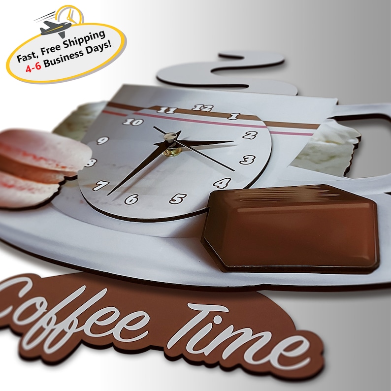 May include: A white coffee cup with a clock face and steam coming out of the top. The clock face has black hands and black numbers. There is a chocolate bar and a pink macaron on the saucer. The words "Coffee Time" are written in white on a brown background.