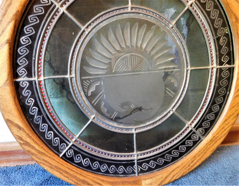 Beautiful Leaded Glass WindowWall Hanging Featuring the Native American Avanyu symbol.