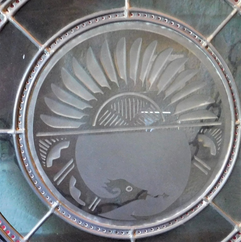 Beautiful Leaded Glass WindowWall Hanging Featuring the Native American Avanyu symbol.