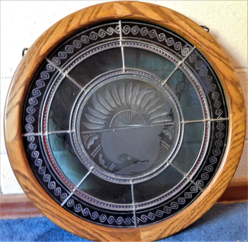 Beautiful Leaded Glass WindowWall Hanging Featuring the Native American Avanyu symbol.