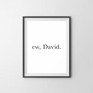 May include: A black framed print with the text "ew, David." on a white background.